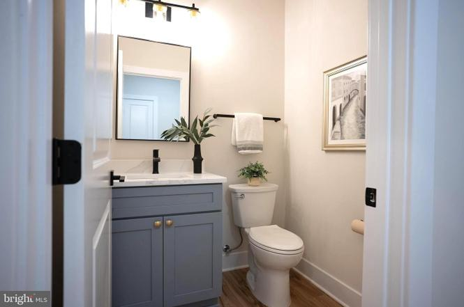 Powder bathroom with blue vanity
